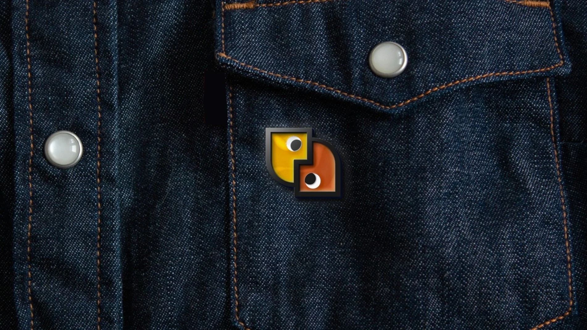 Louder Together enamel badge on denim